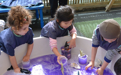 girls water play at daycare
