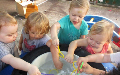 children playing with bubbles at daycare